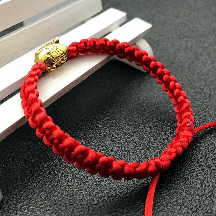 Vòng tay chỉ đỏ heo vàng thắt bím