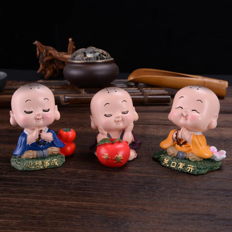 Tượng chibi chú tiểu tươi cười