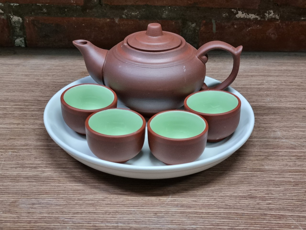 Bộ trà/bộ ấm chén tử sa, gồm 01 ấm, 4 chén trà và 01 khay 20cm, không hộp, nhận in chữ, logo