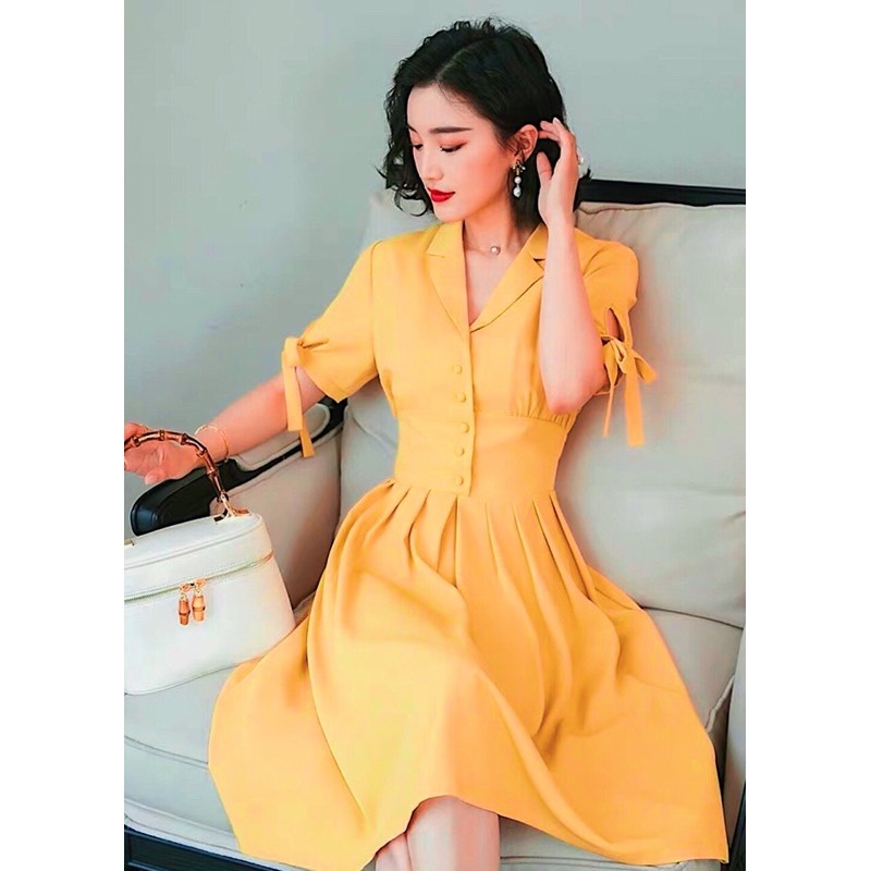 Đầm sm vàng nghệ nút bọc