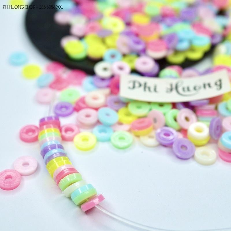 Gói 10g - 25g hạt cườm nhựa hình tròn dẹt 1.5x6mm xỏ vòng tay