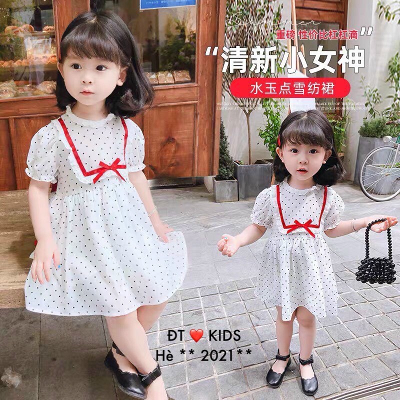Váy đũi chấm bi nhỏ nơ đỏ cho bé gái