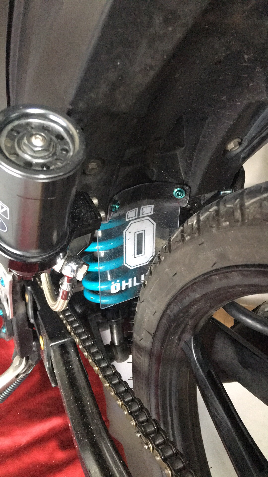 Mica ohlins+2ốc gr5 che phuộc Ex2006-2010