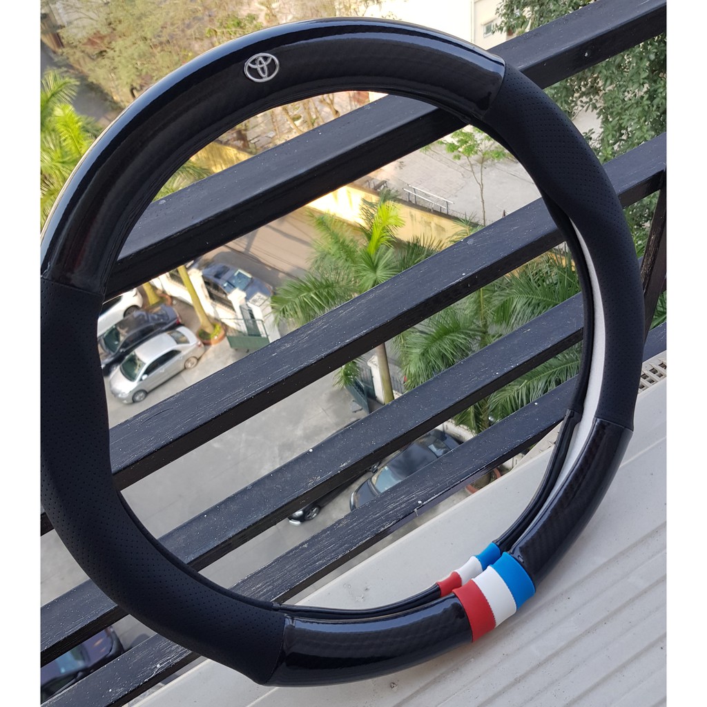 Bọc vô lăng carbon, cờ pháp, da thật thoáng khí, hàng cao cấp