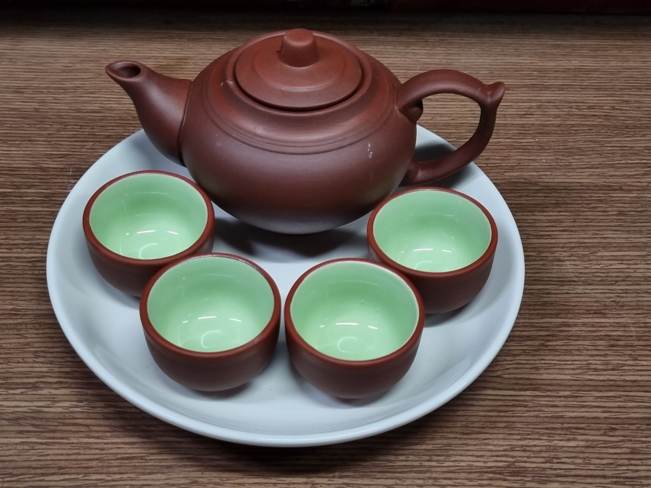 Bộ trà/bộ ấm chén tử sa, gồm 01 ấm, 4 chén trà và 01 khay 20cm, không hộp, nhận in chữ, logo