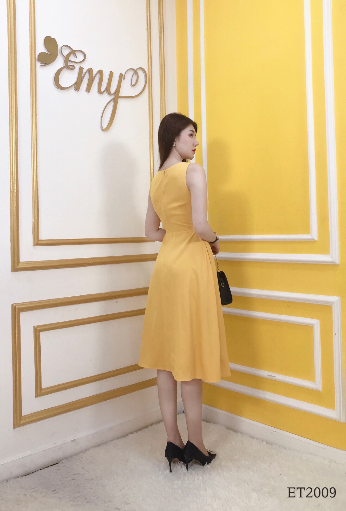 Đầm EMY ET2009 Xoè Vàng Sát Nách