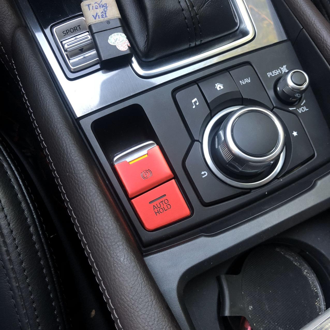 ốp nút phanh tay dòng xe mazda