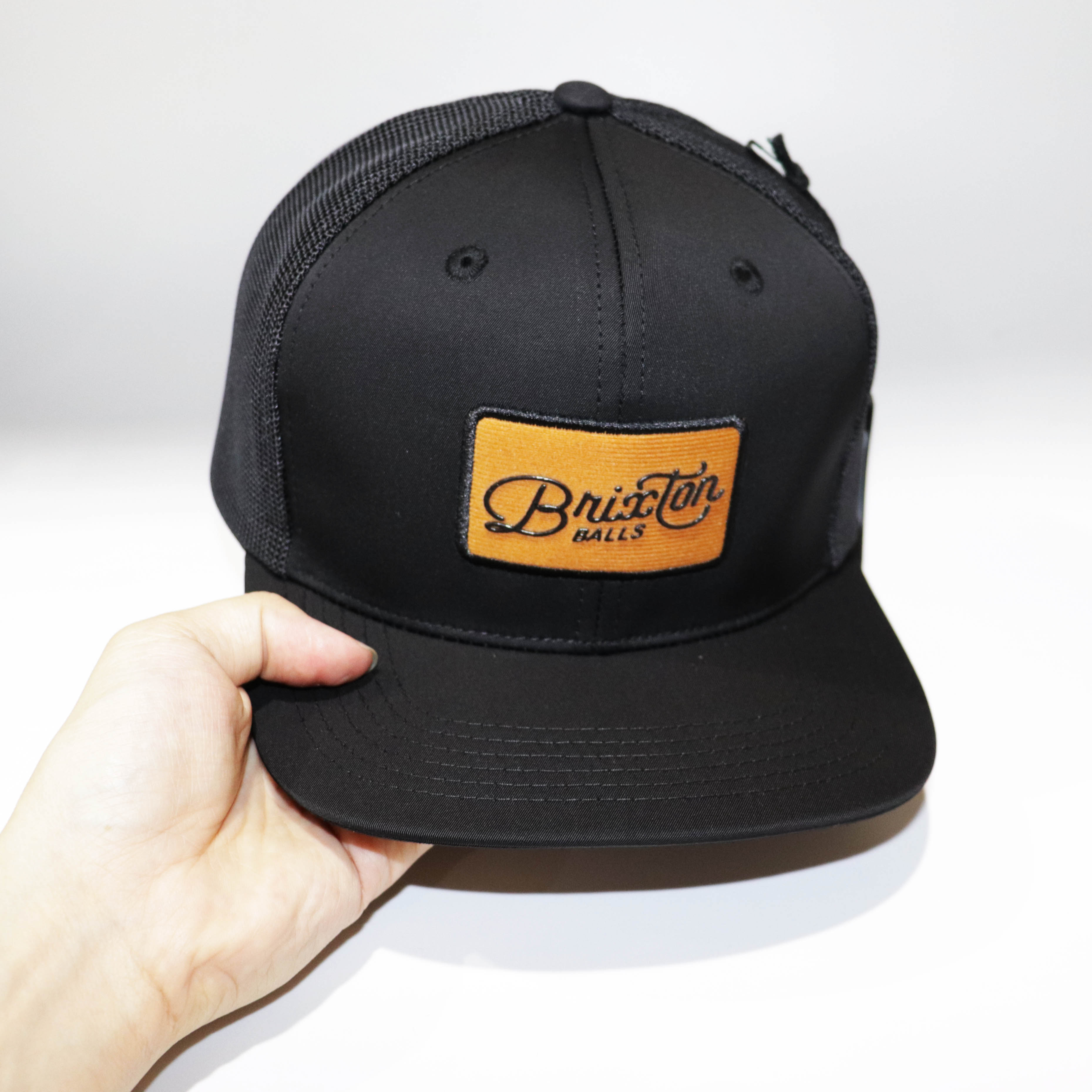 Nón Mũ Snapback Brixton Lưới Đen Logo Vuông Cam 2021.