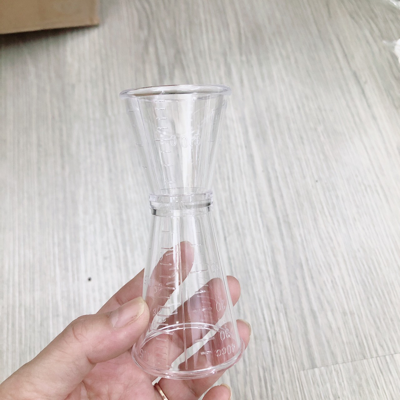 Ly đong định lượng nhựa 2 đầu