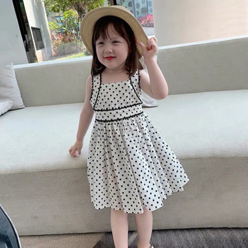 Váy chấm bi viền đen bé gái