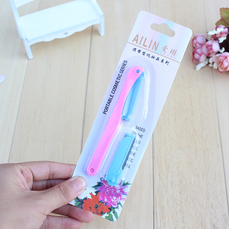 Utility mini eyebrow trimmer with replacement blades
