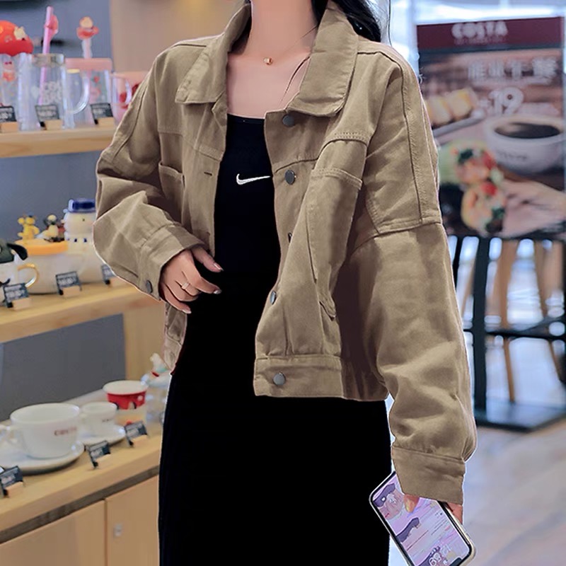 Áo khoác jean nữ cài nút sau lưng dong phuong