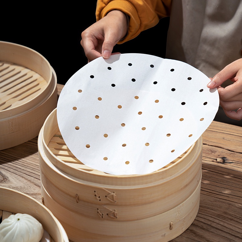 Set 100 giấy nến đục lỗ để hấp, nướng đường kính 23cm.