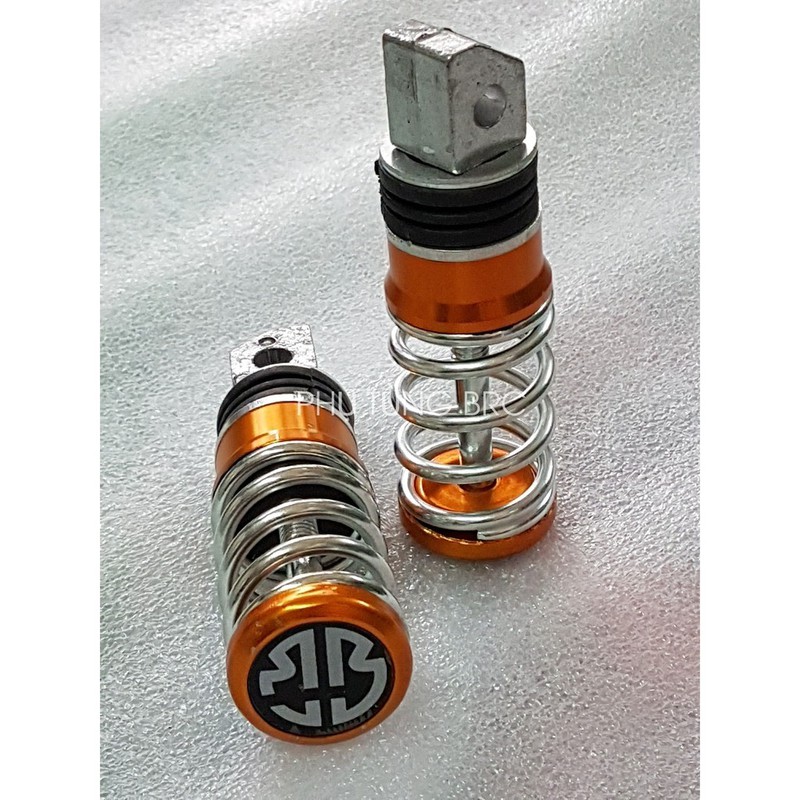 Gác chân sau lò xo xe máy ( SL: 1 cặp, tặng kèm 2 con ốc kiểu để bắt)