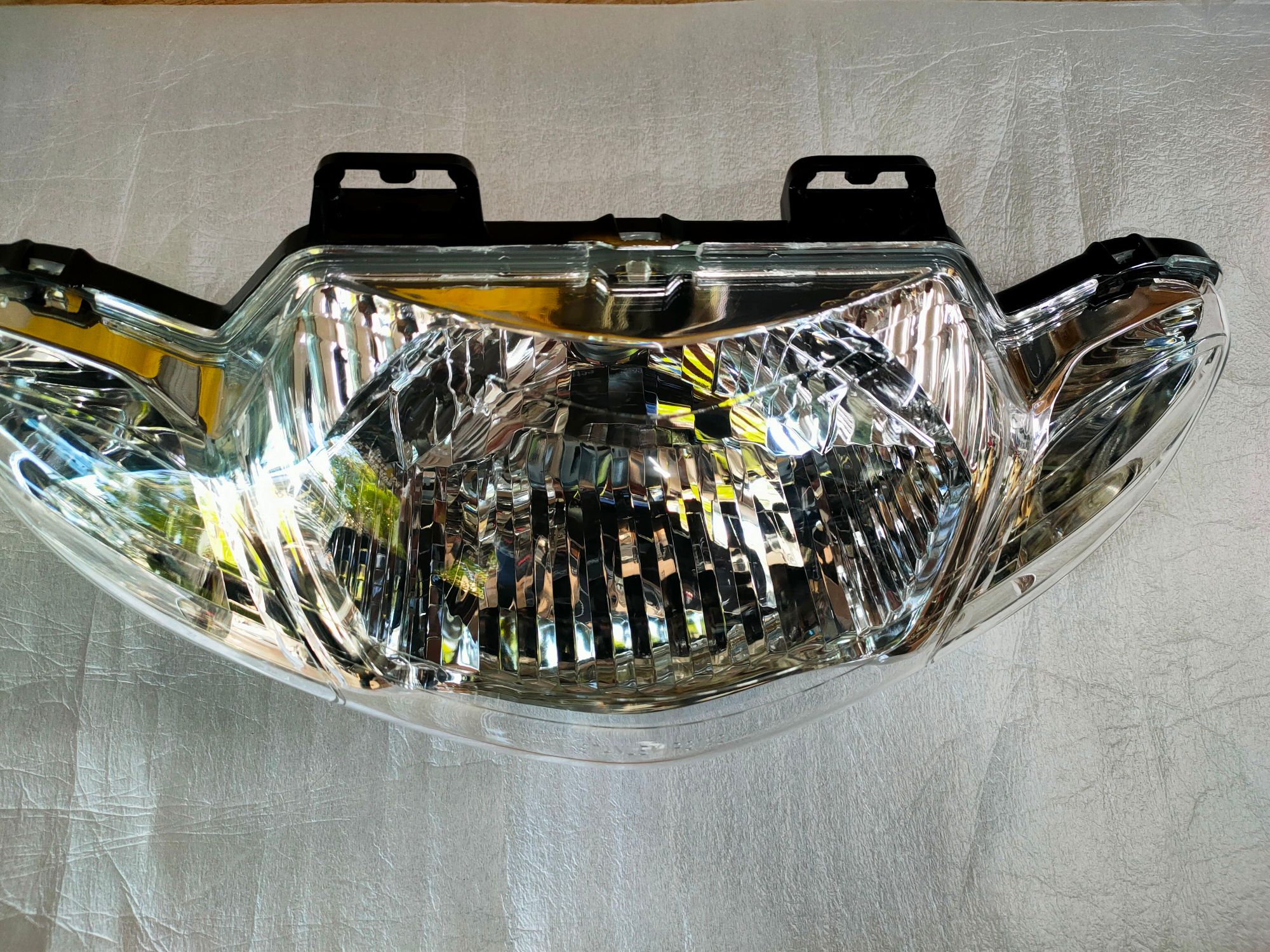 Pha đèn trước Suzuki Smash