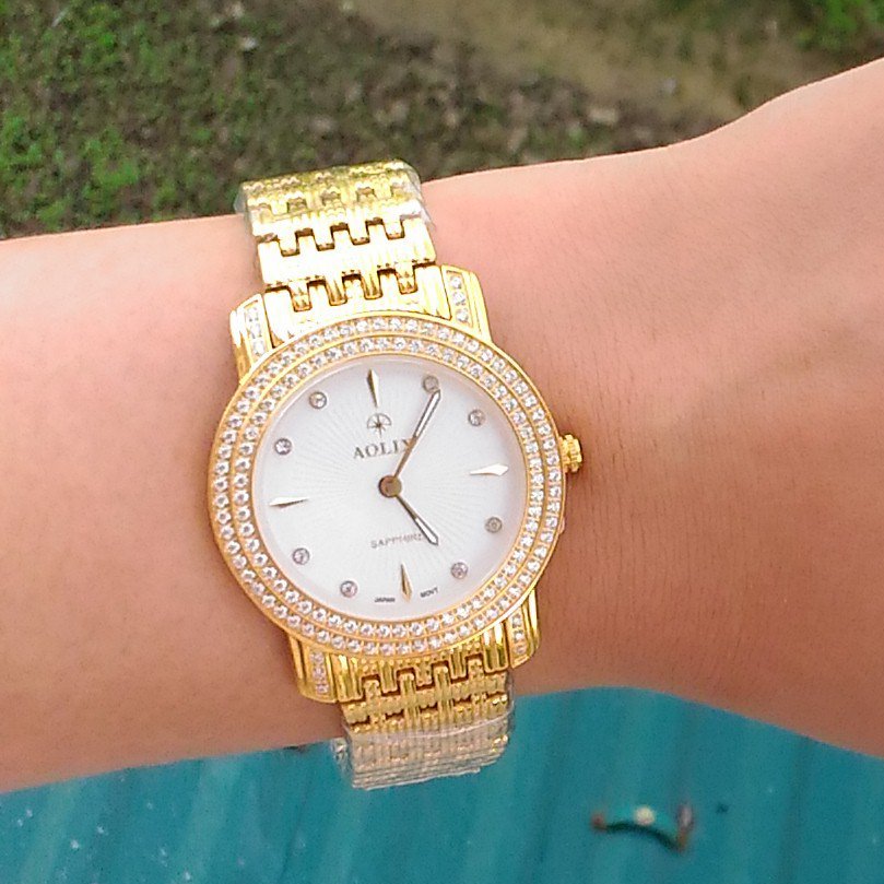 Đồng hồ nữ Aolix AL1031L mặt trắng viền đính đá sang trọng, siêu mỏng, đẳng cấp, kính sapphire chống xước, chống nước tốt.