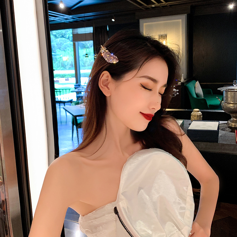 Kẹp tóc họa tiết lông vũ đính đá lấp lánh TOC09