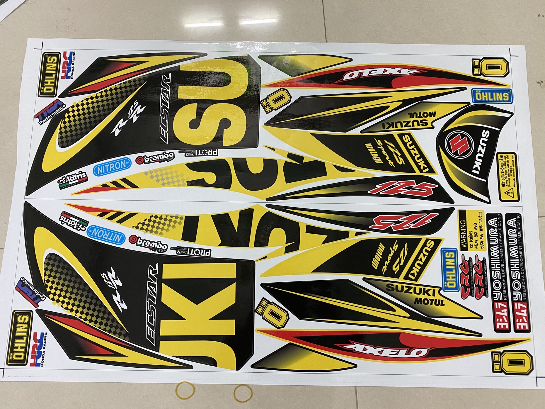 TEM RỜI AXELO CHỮ SUZUKI VÀNG ĐEN