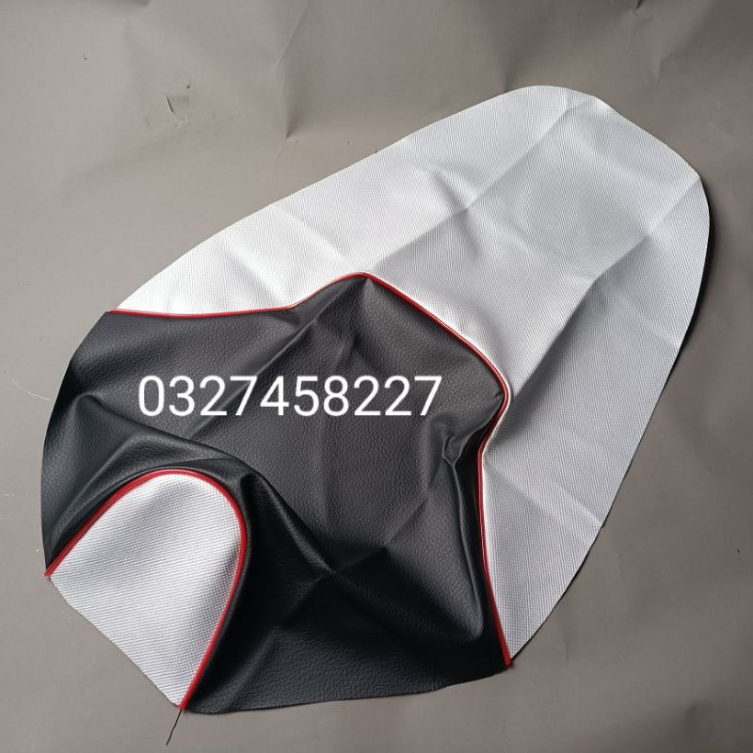Trùm võ da bọc yên ngồi xe exciter 2010 trắng đen , viền đỏ zin