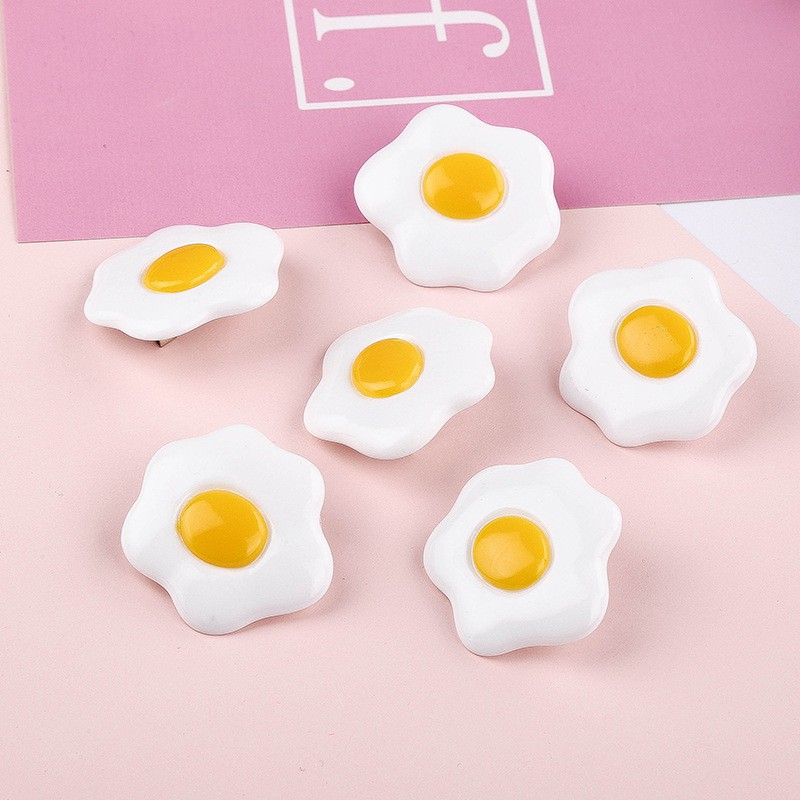 Huy hiệu gắn cặp, cài áo hình trứng