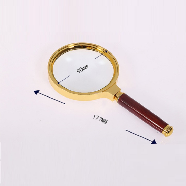 It is a magnifying glass. Gold border, wooden handle, size 80mm,90mm,100mm, for reading, watching small objects. 225.1032