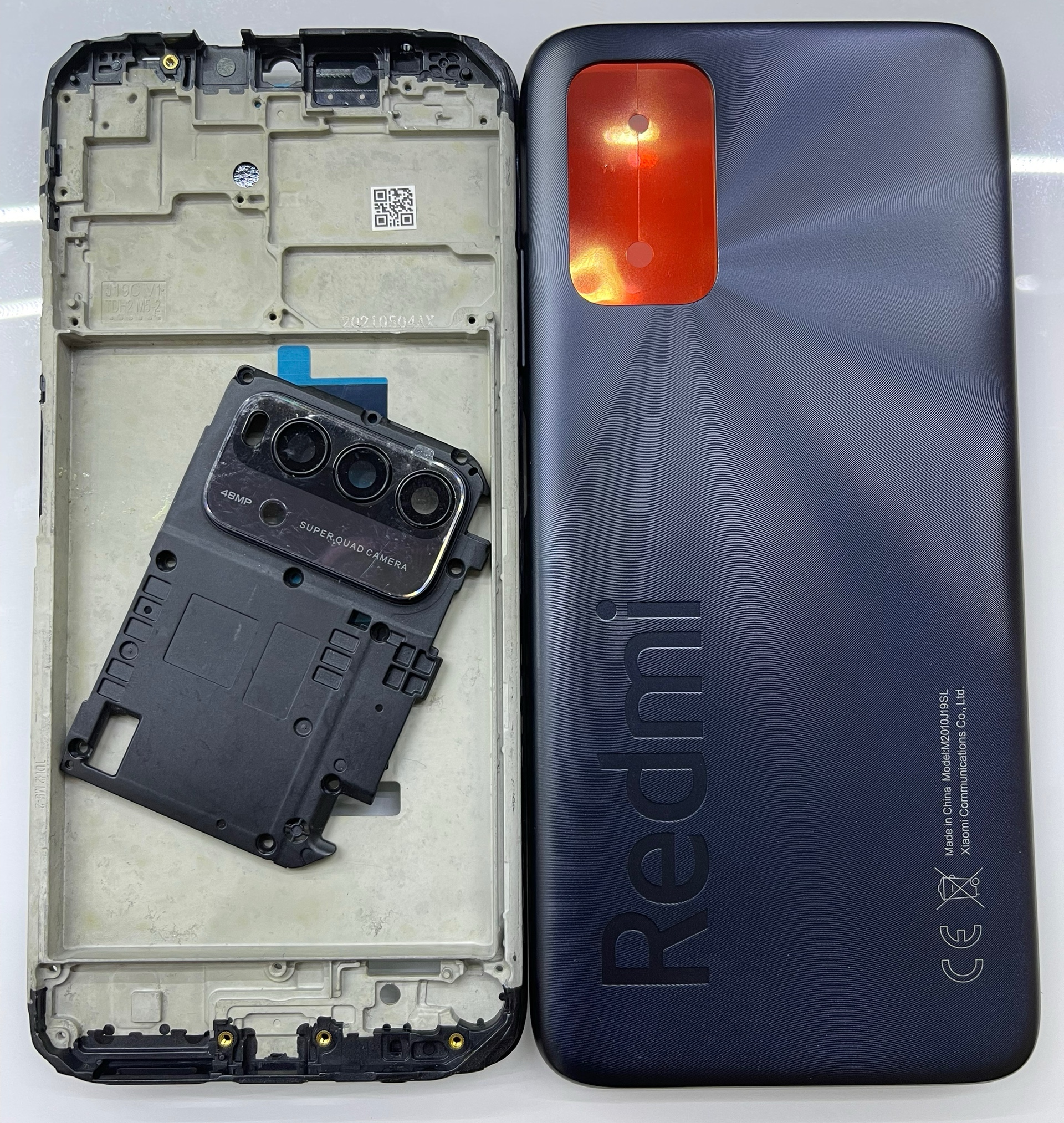Bộ xương vỏ redmi 9t zin kèm kính cam,xương,sườn,lưng,phím bâm)
