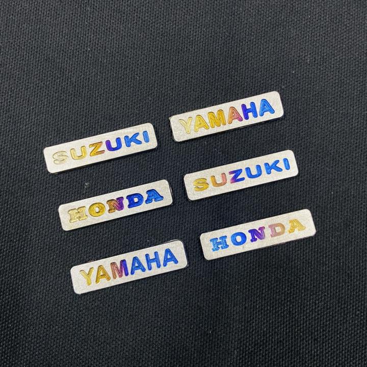 Bộ sưu tập tem titan logo các hãng xe máy Honda, Yamaha, Suzuki, Ohlins...