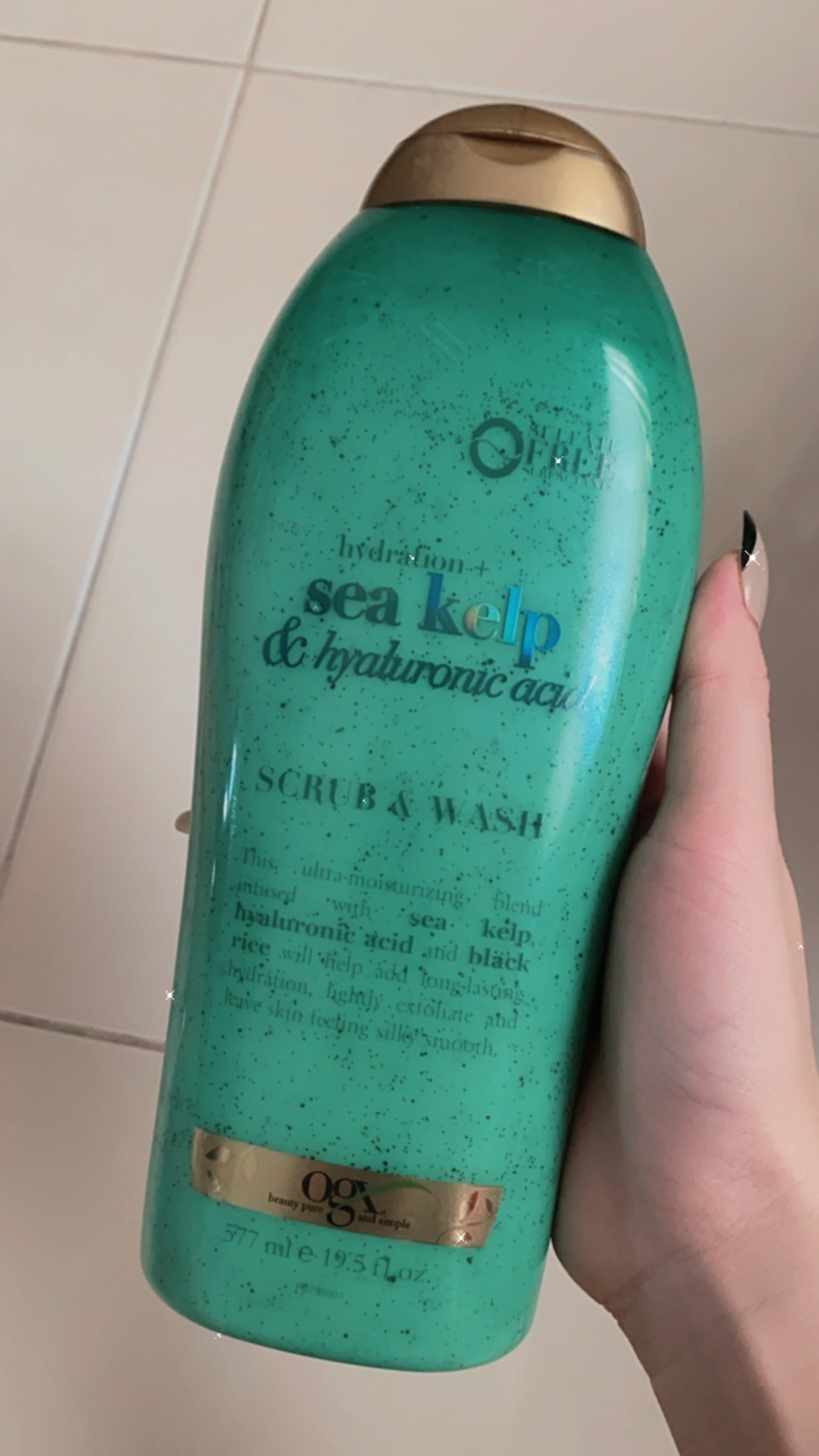 SỮA TẮM OGX CÓ HẠT TẨY TẾ BÀO CHẾT 577ml