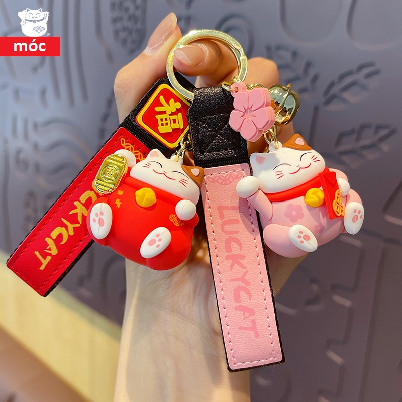 Móc khóa Mèo thần tài ôm vàng bạc