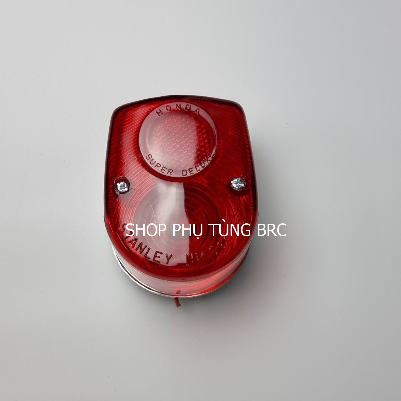 Bộ đèn hậu xe CUB 81 ( chụp đèn màu đỏ không kèm bóng đèn)