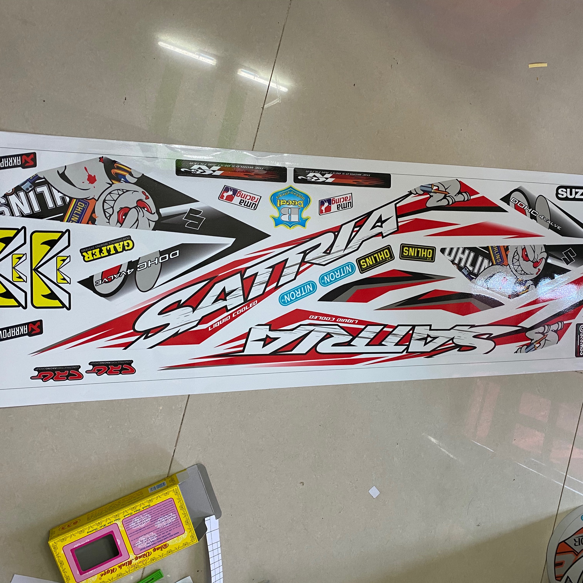 Tem rời Satria Fi mẫu thỏ cầm phuộc dán xe trắng