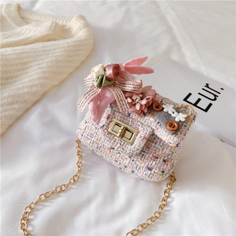 Túi dạ mini đính hoa đeo chéo cho bé