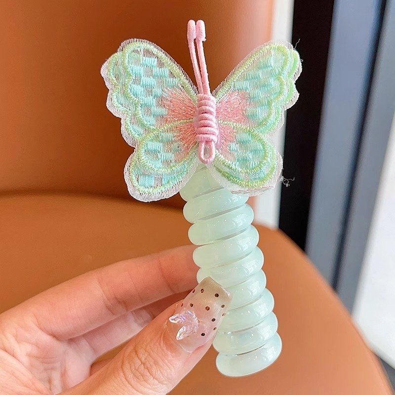 Cột tóc buộc tóc xoắn lò xo hình con bướm xinh xắn đáng yêu cho bé