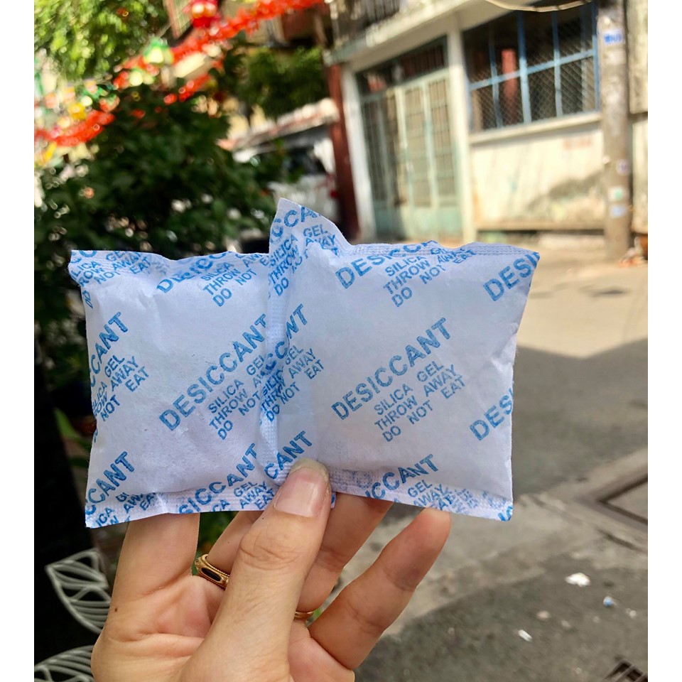 1 Kg gói hút ẩm loại 10 gram (Tặng 2 cuộn băng keo văn phòng)