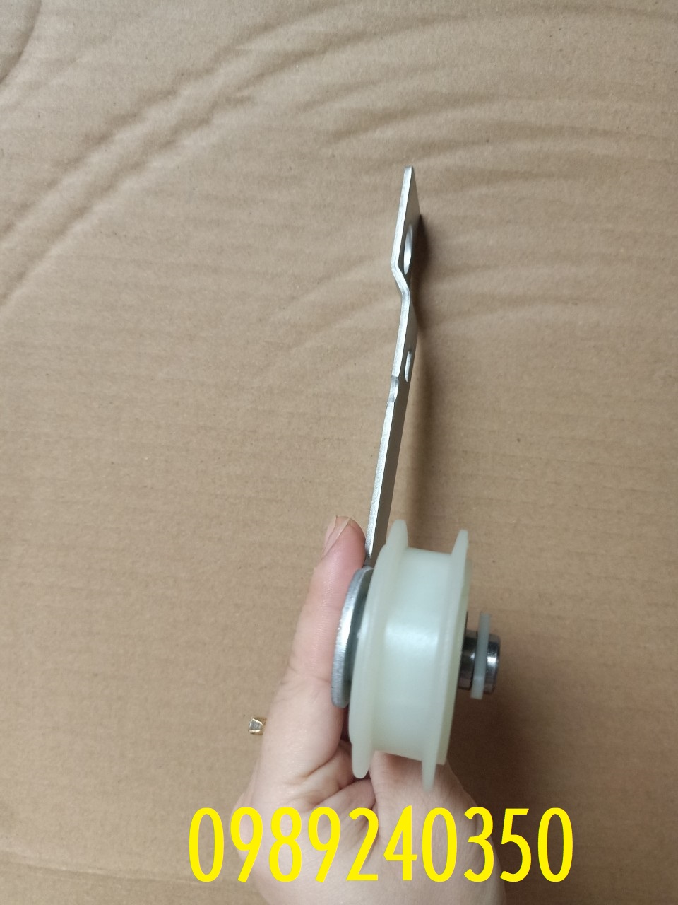 Bánh tỳ căng dây curoa máy sấy Whirlpool