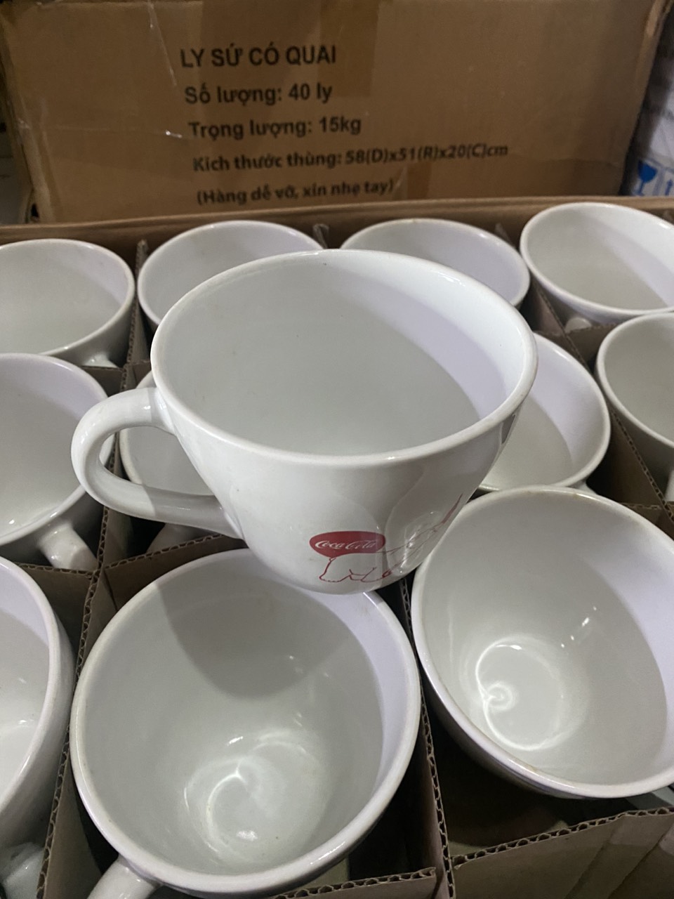 Ly sứ có quai. Hàng Km coca-cola.