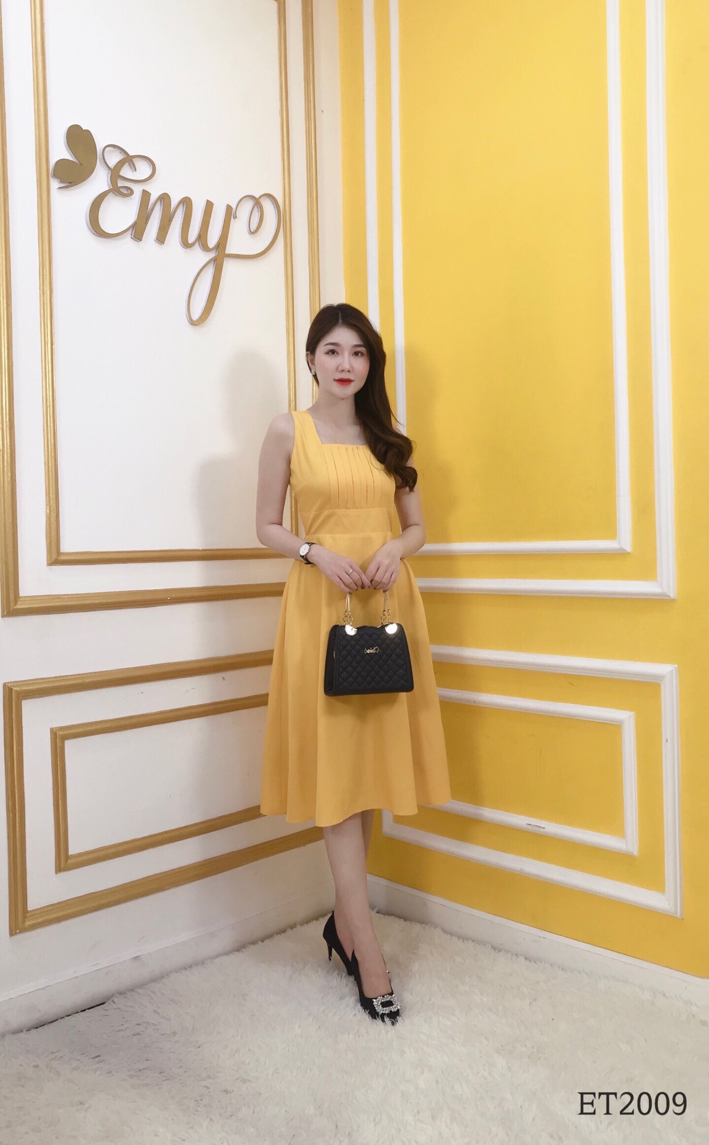 Đầm EMY ET2009 Xoè Vàng Sát Nách