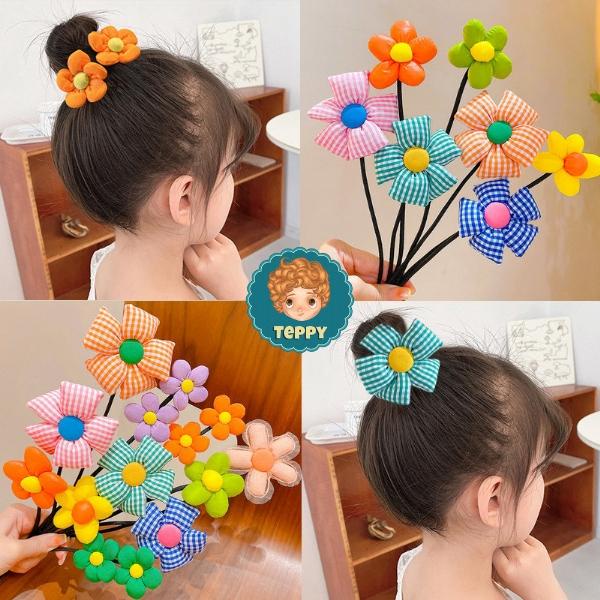 Cột tóc, búi tóc cho bé gái hình bông hoa