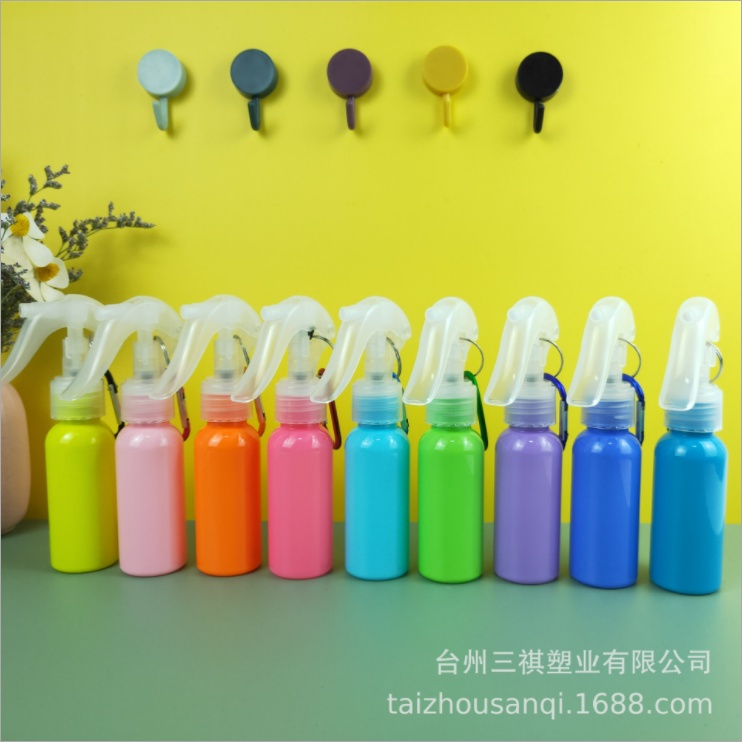 Compact 60ml water bottle with integrated keychain for hand sanitizer.