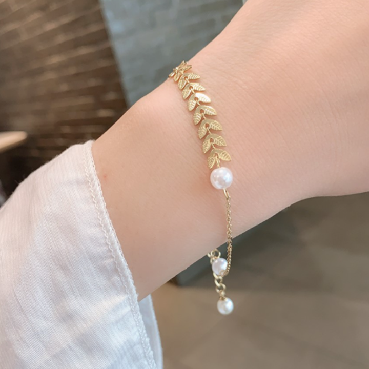 Lắc tay nữ dễ thương vàng kiểu lúa mì phối ngọc trai sang chảnh - Hàng chuẩn titan màu sắc bóng đẹp - Cam kết 1 đổi 1 nếu gỉ sét