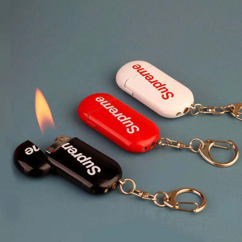 Hột quẹt bật lửa móc khóa SUPREME ga đá rãnh tay mini