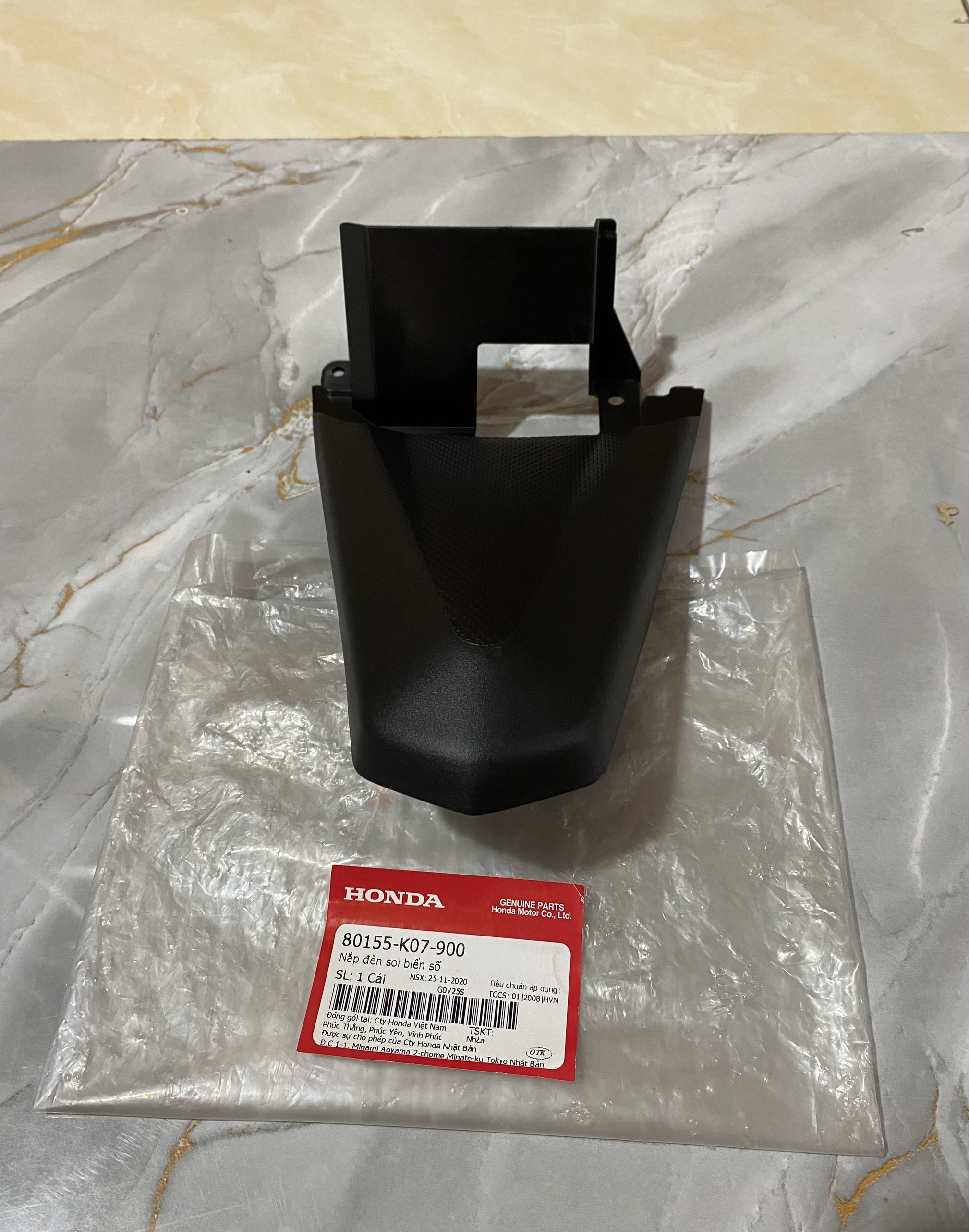 Nắp đèn soi biển số wave rsx 110 2012 màu đen