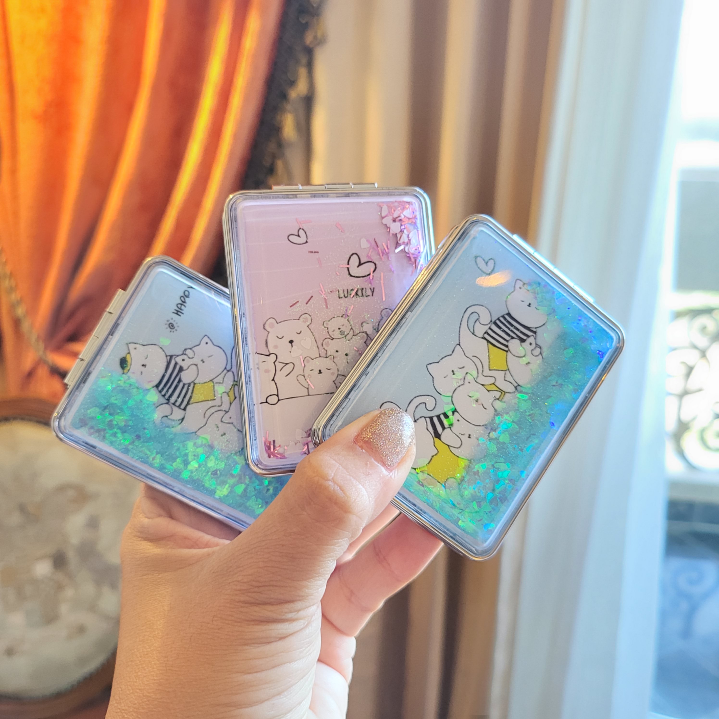 Gương trang điểm mini cầm tay - gương gập 2 mặt kim tuyến nước chảy - kireicos