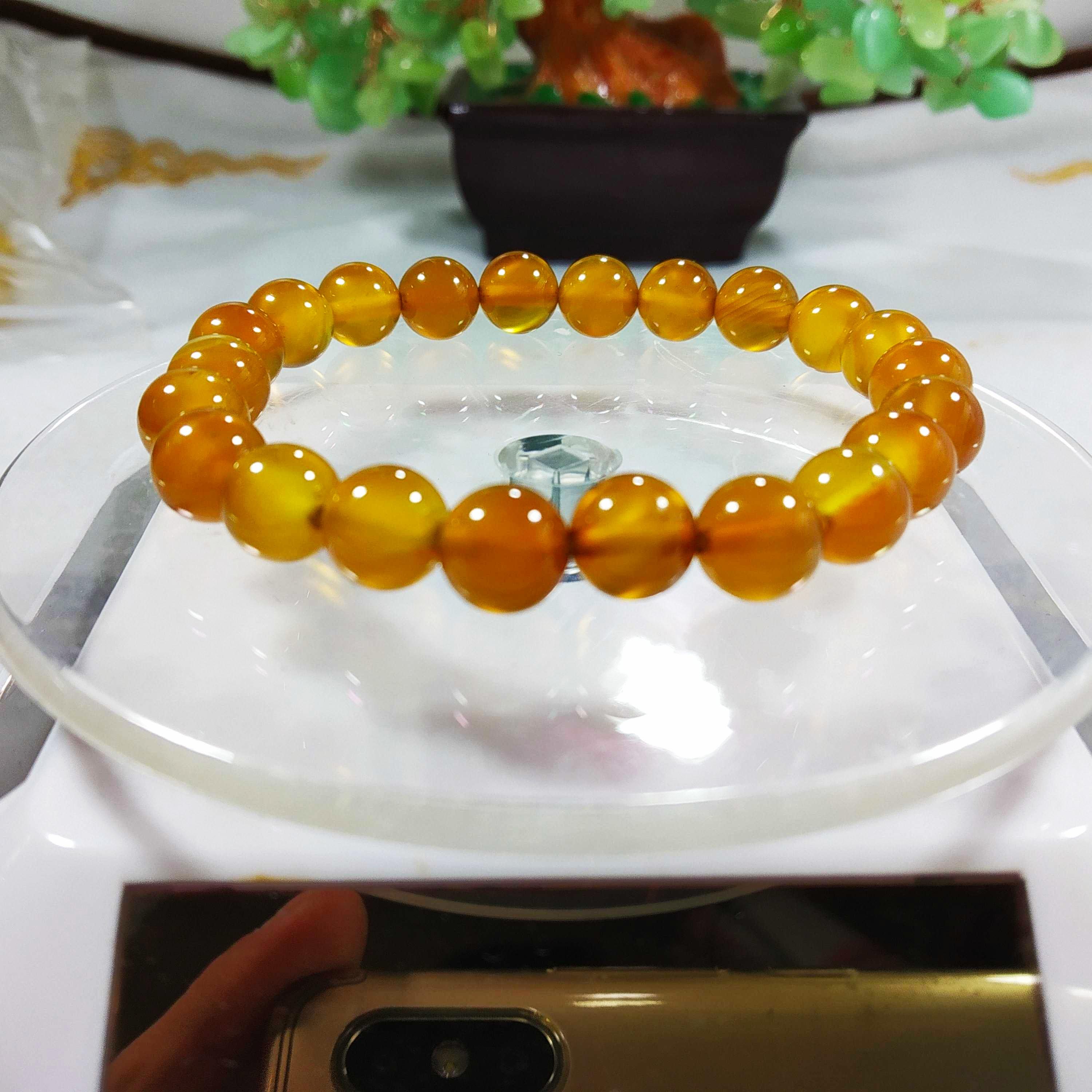 Vòng phong thủy-Vòng đá phong thủy vàng sẫm 8li