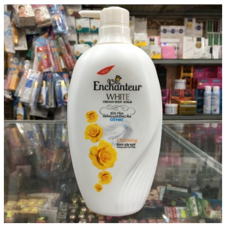 Sữa tắm trắng và dưỡng ẩm có hạt Enchanteur Charming 650g