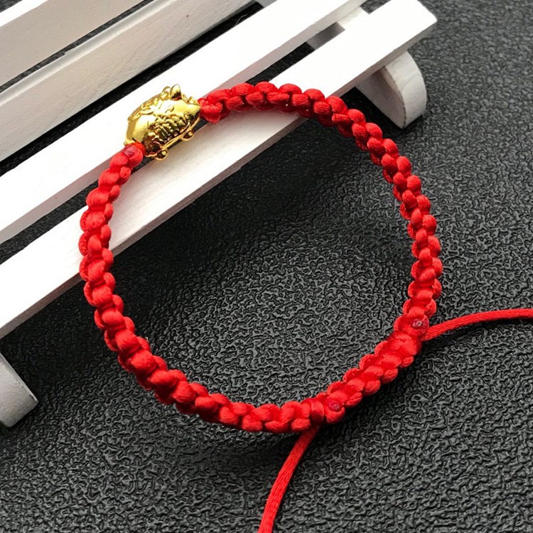 Vòng tay chỉ đỏ heo vàng thắt bím