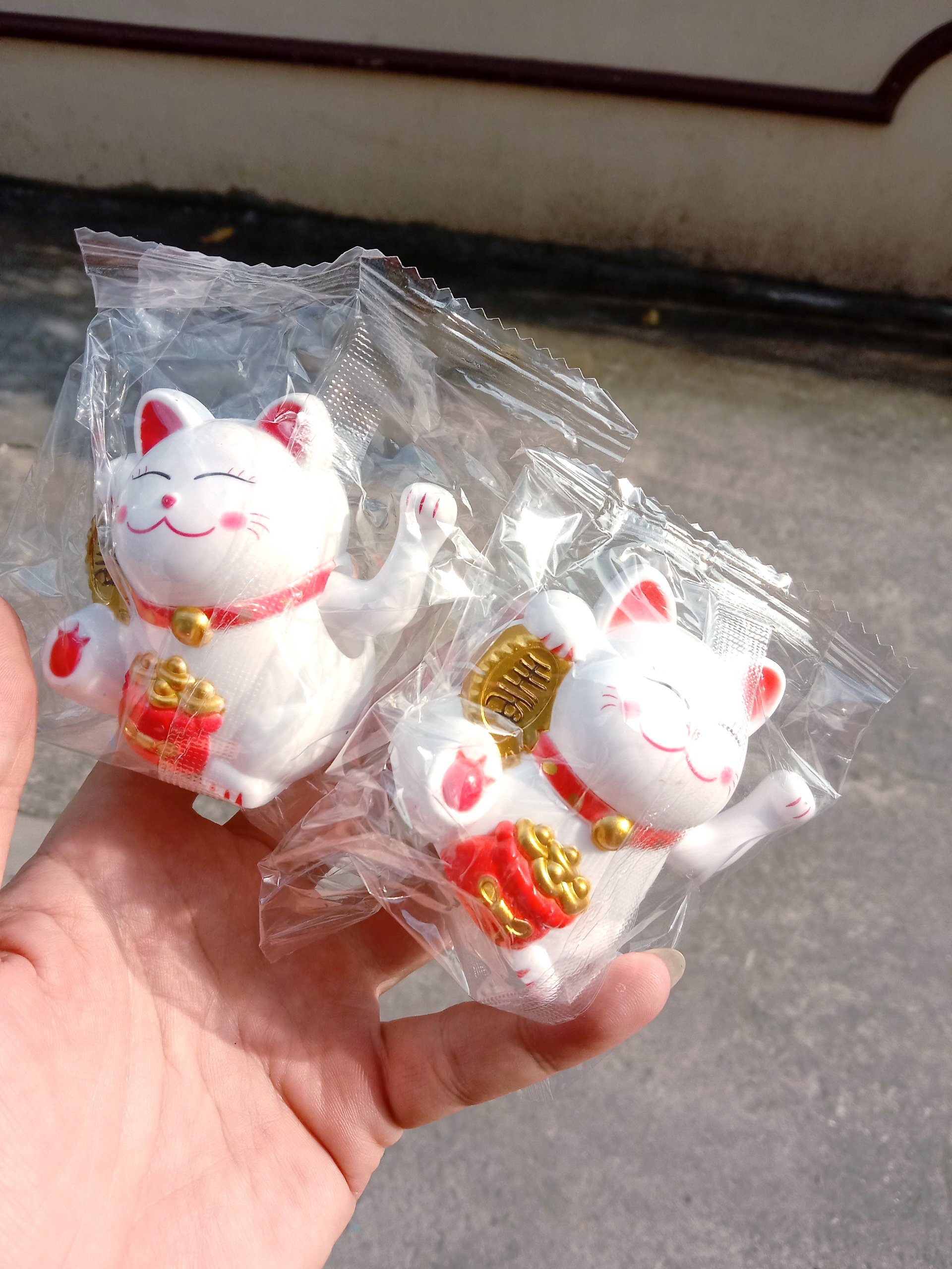 mèo may mắn, thần tài