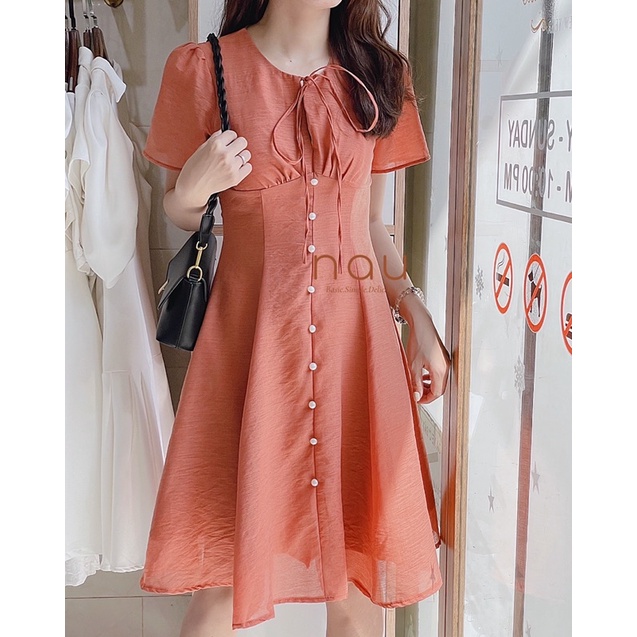 Đầm phối nút ngọc dáng xoè nhẹ cột nơ cổ