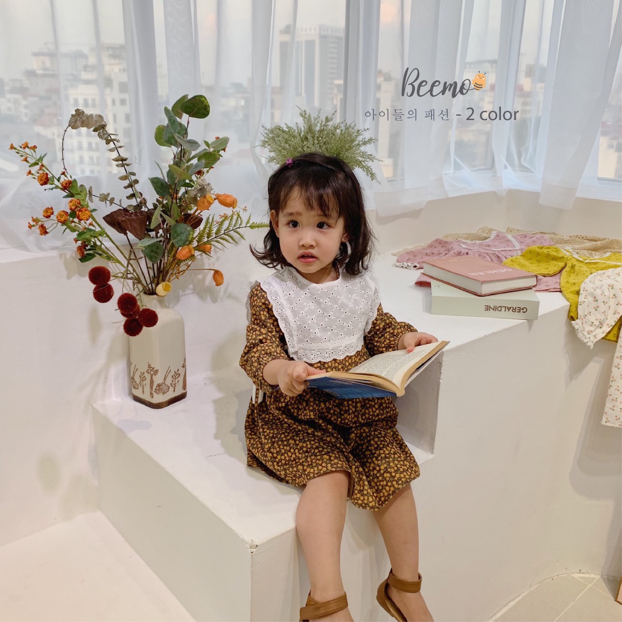Set váy hoa và yếm bé gái