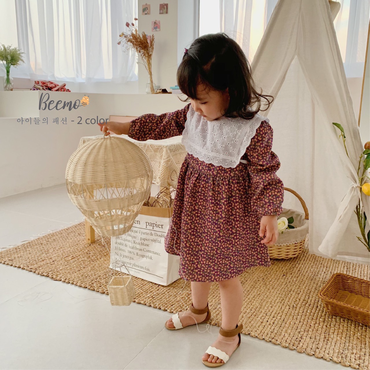 Set váy hoa và yếm bé gái